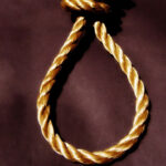 Nudo de cuerda de color dorado sobre un fondo oscuro, representando un lazo.